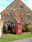 Hiding behind the phone box