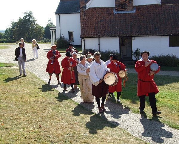 Workshop participants and tutors playing in procession